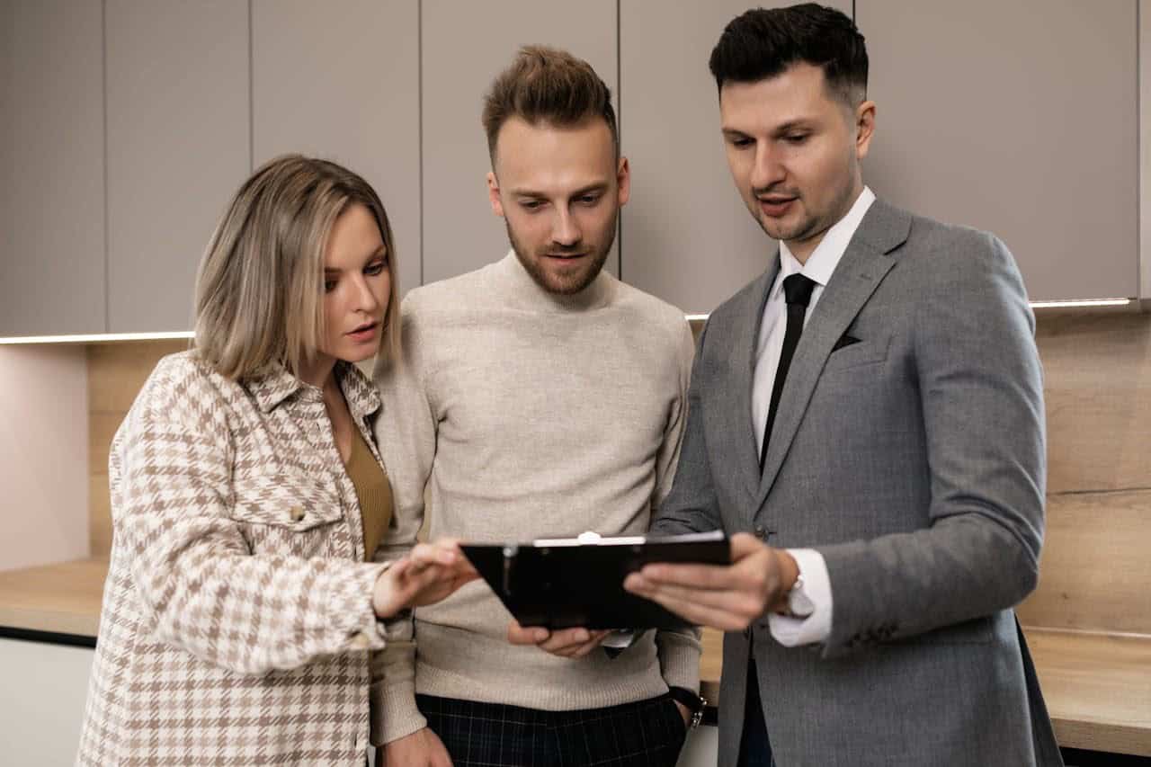 Three people going over a contract, making sure you get your tenancy deposit back