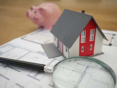 Benefits of Digital Agencies for Portfolio Landlords and Agents Magnifying glass and toy house