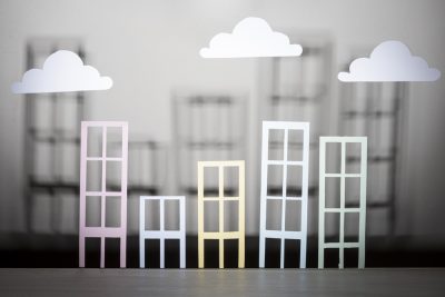 How an Iran–America War Could Reshape Scotland’s Rental and Housing Sales Market paper buildings with clouds