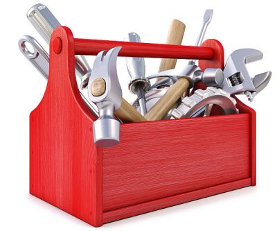 Understanding the Repairing Standard in Scottish Lettings wooden toolbox with tools. isolated on white.